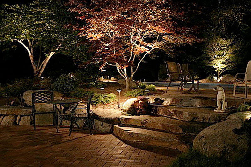 Brick Patio with Steps and Low Voltage Outdoor Lighting Design